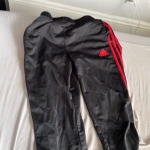 Black and red adidas pants